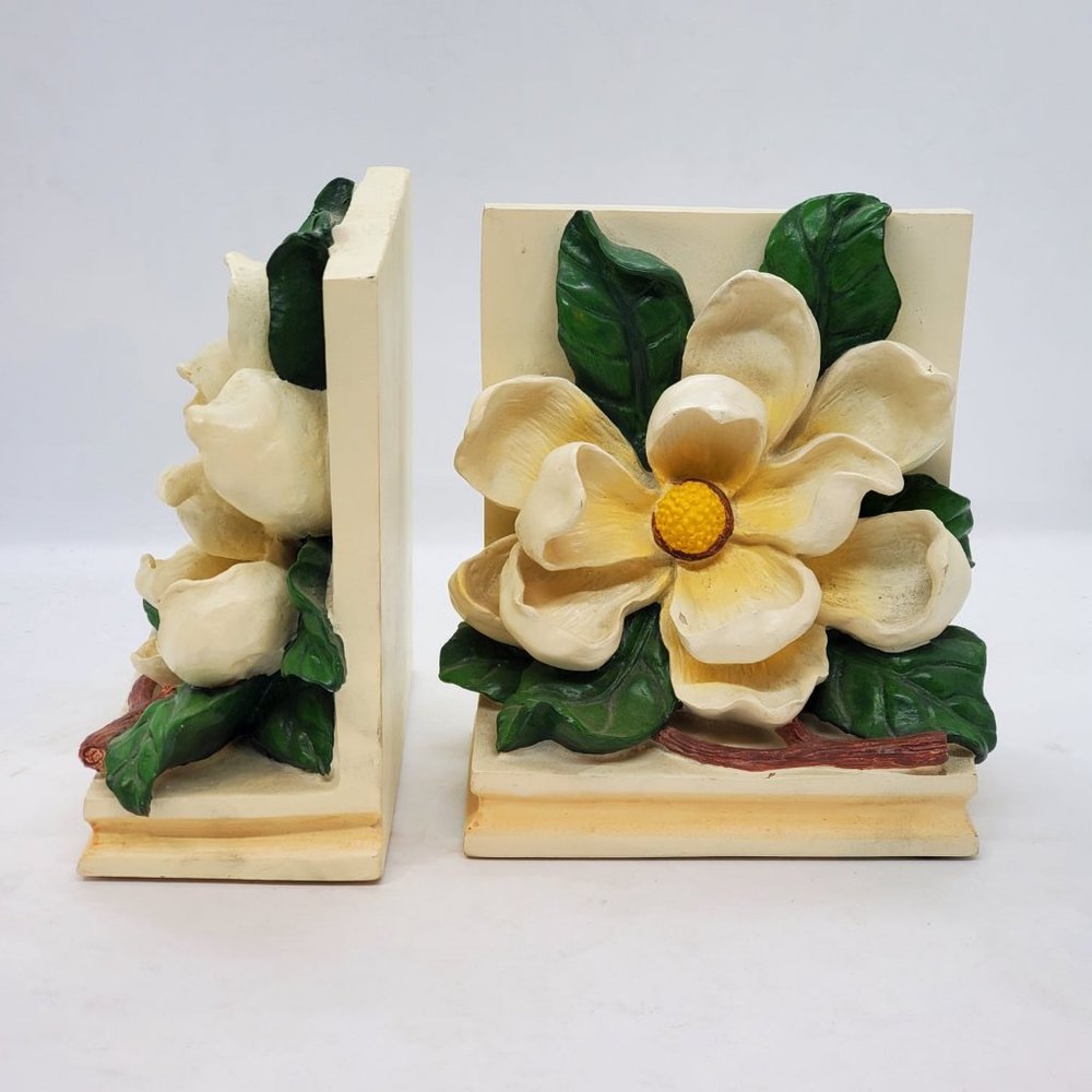 Vintage bookends feature sculptural magnolias